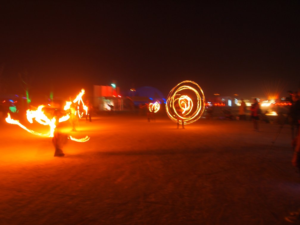 fire dancers at center camp